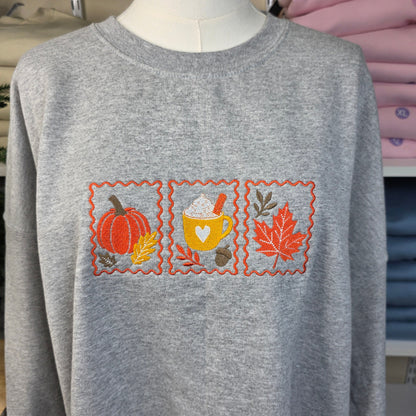 Embroidered Cozy Fall Stamps Sweatshirt