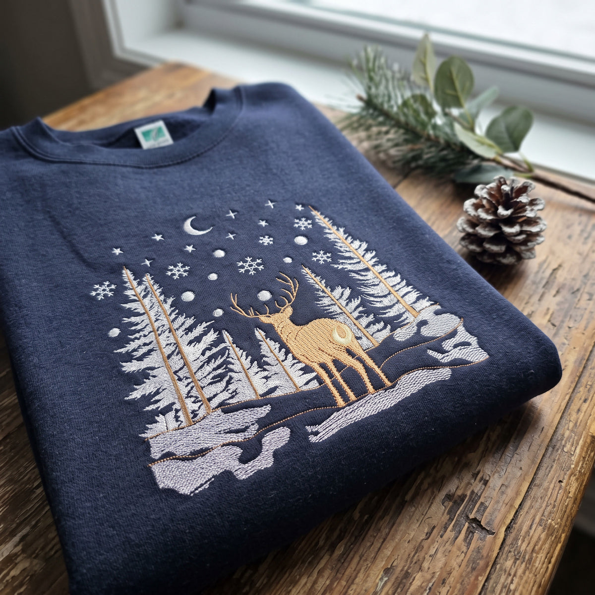Embroidered Winter Forest Magic Premium Sweatshirt (Lane Seven)